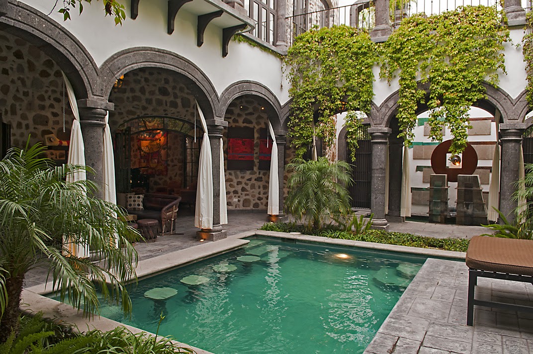 San Miguel de Allende courtyard with turquoise pool and tropical plantings